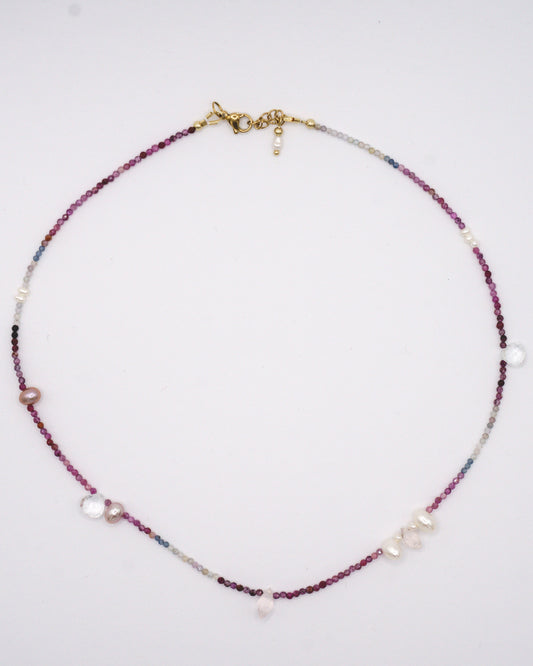 Colorful spinel gemstone necklace with topaz, rose quartz, and freshwater pearl droplets in between.
A specially designed piece that is unique and dainty while being colorful and eclectic.