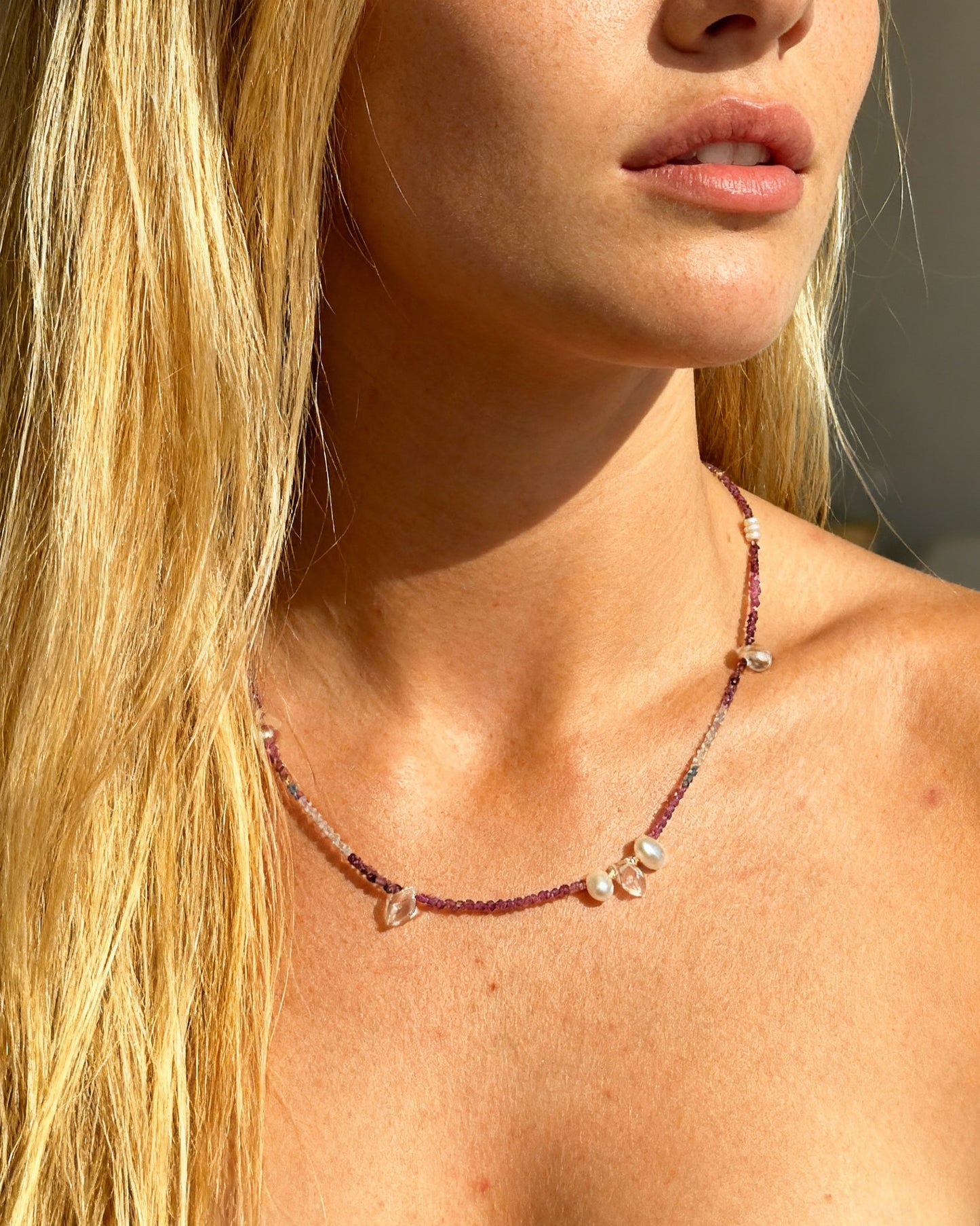 Colorful spinel gemstone necklace with topaz, rose quartz, and freshwater pearl droplets in between.
A specially designed piece that is unique and dainty while being colorful and eclectic.